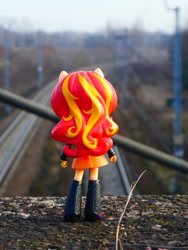 Size: 1024x1365 | Tagged: safe, artist:artofmagicpoland, imported from derpibooru, sunset shimmer, equestria girls, boots, clothes, doll, equestria girls minis, hair, irl, jacket, photo, ponied up, railroad, shoes, skirt, toy