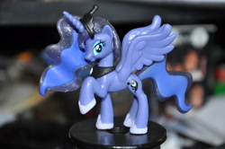 Size: 4288x2848 | Tagged: safe, imported from derpibooru, princess luna, alicorn, blind bag, female, irl, looking at you, mare, photo, raised hoof, toy