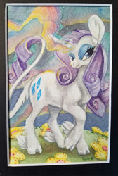 Size: 499x744 | Tagged: safe, artist:sparkynekomi, imported from derpibooru, rarity, classical unicorn, pony, unicorn, big ears, cloven hooves, curved horn, female, flower, glowing horn, leonine tail, mare, solo, traditional art, unshorn fetlocks, watercolor painting