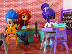 Size: 1480x1110 | Tagged: safe, artist:whatthehell!?, imported from derpibooru, flash sentry, sci-twi, sunset shimmer, twilight sparkle, equestria girls, apple, book, boots, chair, chalkboard, classroom, clothes, desk, doll, equestria girls minis, eqventures of the minis, female, flashimmer, flashlight, food, guitar, irl, jacket, male, pair, pants, photo, school, shipping, shoes, straight, toy, triangle, tuxedo