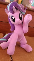 Size: 675x1200 | Tagged: safe, artist:nekokevin, imported from derpibooru, starlight glimmer, pony, unicorn, series:nekokevin's glimmy, cute, female, glimmerbetes, irl, looking at you, mare, photo, plushie, raised hoof, sitting, smiling, solo, sweet dreams fuel, underhoof, waving