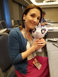 Size: 1536x2048 | Tagged: safe, imported from derpibooru, starlight glimmer, human, babscon, babscon 2018, female, filly, filly starlight glimmer, hug, irl, irl human, kelly sheridan, photo, pigtails, plushie, smiling, voice actor, younger