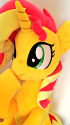 Size: 576x1024 | Tagged: safe, artist:nekokevin, imported from derpibooru, sunset shimmer, pony, unicorn, boop, cute, female, irl, lying down, mare, photo, plushie, raised hoof, self-boop, shimmerbetes, shimmerposting, smiling, solo, underhoof