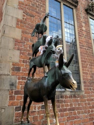 Size: 2373x3163 | Tagged: safe, artist:junky2k, imported from derpibooru, derpy hooves, oc, oc:velvet remedy, pony, fallout equestria, bremen, high res, irl, photo, plushie, ponies around the world, statue, the bremen musicians