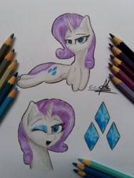 Size: 3096x4128 | Tagged: safe, artist:ironbeastz, imported from derpibooru, rarity, pony, bust, female, one eye closed, pencil, portrait, prone, solo, traditional art, wink