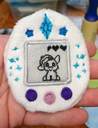 Size: 2323x3028 | Tagged: safe, artist:sew-adorkable, artist:sew_adorkable, imported from derpibooru, rarity, fluffy, irl, photo, plushie, ponygotchi, tamagotchi, toy