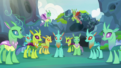 Size: 1280x720 | Tagged: safe, imported from derpibooru, screencap, arista, clypeus, cornicle, lokiax, soupling, changedling, changeling, to change a changeling, background changeling, changeling hive, crowd, frenulum (g4), looking at you