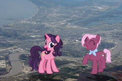 Size: 700x467 | Tagged: safe, artist:jerryakira79, imported from derpibooru, jasmine leaf, jiffy bake, earth pony, pony, unicorn, duo, female, giant ponies in real life, giant pony, giantess, highrise ponies, irl, macro, mare, photo, ponies in real life