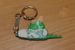 Size: 1024x682 | Tagged: safe, artist:king-franchesco, imported from derpibooru, oc, oc only, pony, unicorn, eyes closed, female, hooves, horn, hug, irl, keychain, lying down, mare, photo, pillow, pillow hug, sleeping, solo, watermark