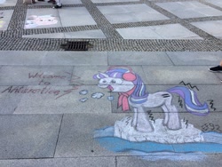 Size: 1200x900 | Tagged: safe, imported from derpibooru, photographer:squeakybelle, starlight glimmer, pony, antarctica, chalk, chalk drawing, clothes, cold, earmuffs, equal cutie mark, equalized, female, freezing, galacon, ice, scarf, shivering, smiling, solo, traditional art, water