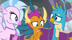 Size: 1280x720 | Tagged: safe, imported from derpibooru, screencap, gallus, silverstream, smolder, dragon, griffon, hippogriff, the end in friend, dragoness, female, jewelry, male, necklace, notebook, raised eyebrow, reading, trio