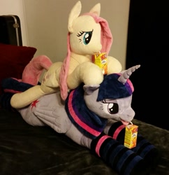Size: 939x969 | Tagged: safe, artist:blackwater627, artist:neysanight, imported from derpibooru, fluttershy, twilight sparkle, alicorn, pegasus, pony, bedroom eyes, clothes, drink, drinking, drinking straw, ear piercing, earring, female, irl, jewelry, juice, juice box, laying on bed, lying down, lying on bed, necklace, photo, piercing, plushie, socks, stack, striped socks, tongue out, twilight sparkle (alicorn)