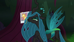 Size: 1280x720 | Tagged: safe, imported from derpibooru, screencap, applejack, queen chrysalis, changeling, changeling queen, pony, the mean 6, female, hair, nose wrinkle, photo, picture, solo, tree