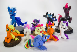 Size: 1280x853 | Tagged: safe, artist:dustysculptures, imported from derpibooru, apple bloom, applejack, nightmare moon, rainbow dash, rarity, scootaloo, sweetie belle, tempest shadow, twilight sparkle, alicorn, earth pony, pegasus, pony, unicorn, bronycon, bronycon 2018, arm behind head, bipedal, book, bookhorse, cape, clothes, craft, cutie mark crusaders, female, filly, hear no evil, irl, mare, on back, photo, prone, sculpture, see no evil, sitting, speak no evil, three wise monkeys, three wise ponies, trixie's cape