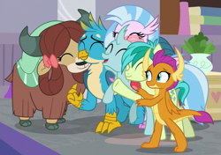 Size: 647x455 | Tagged: safe, imported from derpibooru, screencap, gallus, ocellus, sandbar, silverstream, smolder, yona, changedling, changeling, classical hippogriff, dragon, earth pony, griffon, hippogriff, pony, yak, the hearth's warming club, bow, cloven hooves, cute, diaocelles, diastreamies, dragoness, female, gallabetes, group hug, hair bow, hug, jewelry, male, monkey swings, necklace, sandabetes, smolderbetes, student six, teenager, yonadorable