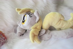 Size: 5472x3648 | Tagged: safe, artist:kazzysart, imported from derpibooru, derpy hooves, pegasus, pony, beanie (plushie), female, folded wings, irl, mare, photo, plushie, prone, solo, wings