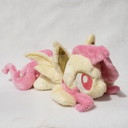 Size: 1024x1024 | Tagged: safe, artist:appledew, imported from derpibooru, fluttershy, bat pony, pony, bat ears, bat wings, beanie (plushie), female, flutterbat, irl, mare, photo, plushie, prone, race swap, solo, wings