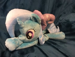 Size: 1200x900 | Tagged: dead source, safe, artist:sophieascruggs, artist:sophillia, imported from derpibooru, trixie, pony, unicorn, clothes, female, hat, irl, lying down, mare, photo, plushie, smiling, solo, trixie's hat