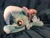 Size: 1200x900 | Tagged: dead source, safe, artist:sophieascruggs, artist:sophillia, imported from derpibooru, trixie, pony, unicorn, clothes, female, hat, irl, lying down, mare, photo, plushie, smiling, solo, trixie's hat