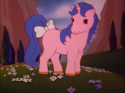 Size: 720x537 | Tagged: safe, imported from derpibooru, screencap, majesty, my little pony 'n friends, the golden horseshoes, blank flank, bow, female, flower, g1, golden horseshoes, mountain, pasture, pinkjesty, quatrefoil, special unicorn, tail bow