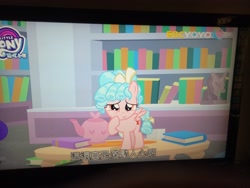 Size: 4160x3120 | Tagged: safe, imported from derpibooru, screencap, cozy glow, pegasus, pony, what lies beneath, book, bookshelf, female, filly, irl, photo, solo, subtitles, teapot, yoyotv