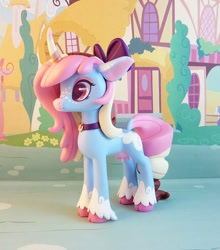 Size: 749x850 | Tagged: safe, artist:krowzivitch, imported from derpibooru, oc, oc only, oc:polly, cow, cow pony, pony, unicorn, bow, choker, cloven hooves, craft, curved horn, female, figurine, hair bow, heart eyes, horn, mare, sculpture, solo, traditional art, udder, unshorn fetlocks, wingding eyes