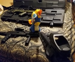 Size: 1831x1512 | Tagged: safe, imported from derpibooru, spitfire, pegasus, pony, ar-15, ar15, bed, chibi, female, gun, irl, kel-tec rfb, mare, photo, plushie, solo, weapon