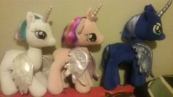 Size: 2560x1440 | Tagged: safe, imported from derpibooru, princess cadance, princess celestia, princess luna, alicorn, pony, female, haircut, irl, manecut, photo, plushie