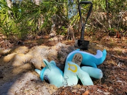 Size: 4032x3024 | Tagged: safe, artist:hoppip, imported from derpibooru, lyra heartstrings, pony, unicorn, 4chan, dirt, female, grave, gravestone, hole, insertion, irl, lyra plushie, mare, op is a duck, outdoors, photo, plant, plothole plush lyra, plushie, shovel, solo