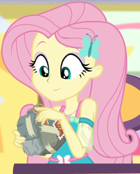 Size: 618x765 | Tagged: safe, imported from derpibooru, screencap, fluttershy, equestria girls, equestria girls series, holidays unwrapped, spoiler:eqg series (season 2), bad gift wrapping, burger, canterlot mall, chair, clothes, cropped, cute, dashing through the mall, dress, female, flower, fluttershy boho dress, food, geode of fauna, gift giving, gift wrapped, hairclip, jewelry, looking down, magical geodes, mall, necklace, present, shyabetes, sitting, smiling, stamp, table, waistband