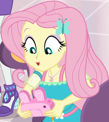 Size: 857x967 | Tagged: safe, imported from derpibooru, screencap, fluttershy, rarity, equestria girls, equestria girls series, holidays unwrapped, spoiler:eqg series (season 2), bunny ears, camera, canterlot mall, chair, clothes, cropped, cute, dashing through the mall, dress, female, flower, fluttershy boho dress, geode of fauna, gift giving, hairclip, happy, jewelry, looking down, magical geodes, mall, necklace, present, shyabetes, sitting, smiling, table, waistband