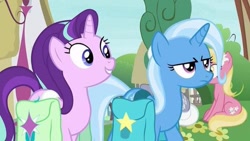 Size: 563x317 | Tagged: safe, imported from derpibooru, screencap, starlight glimmer, trixie, unicorn, bag, duo focus, ponyville, saddle bag, trixie is not amused, unamused