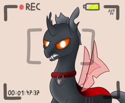 Size: 1024x846 | Tagged: safe, artist:atomfliege, imported from derpibooru, oc, oc only, oc:dragi, changeling, angry, camera, camera shot, changeling oc, collar, looking at you, recording, red changeling, simple background, solo, teeth