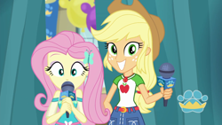 Size: 1920x1080 | Tagged: safe, imported from derpibooru, screencap, applejack, fluttershy, best in show: the pre-show, equestria girls, equestria girls series, spoiler:eqg series (season 2), applejack's hat, belt, best in show logo, clothes, cowboy hat, cute, cutie mark, cutie mark on clothes, denim skirt, female, geode of fauna, geode of super strength, grin, hairpin, hat, jackabetes, jewelry, magical geodes, microphone, necklace, shyabetes, skirt, smiling