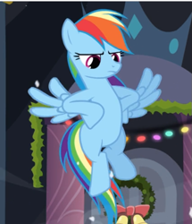 Size: 551x641 | Tagged: safe, imported from derpibooru, screencap, rainbow dash, pegasus, pony, hearth's warming eve (episode), cropped, female, flying, hooves on hips, mare, rainbow dash is not amused, solo, spread wings, unamused, wings