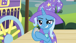 Size: 1280x720 | Tagged: safe, imported from derpibooru, screencap, trixie, pony, uncommon bond, crumpled, female, grin, hoof hold, mare, newspaper, smiling, solo