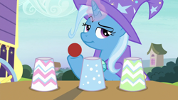 Size: 1280x720 | Tagged: safe, imported from derpibooru, screencap, trixie, pony, uncommon bond, ball, cup, female, glowing horn, hoof hold, lidded eyes, magic trick, mare, smiling, smirk, solo