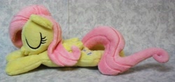 Size: 3158x1492 | Tagged: safe, artist:bluedragonflyplush, imported from derpibooru, fluttershy, pegasus, pony, beanie (plushie), eyes closed, folded wings, irl, photo, plushie, prone, sleeping, solo, wings