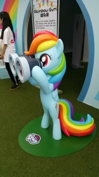 Size: 1120x1992 | Tagged: safe, imported from derpibooru, photographer:yinglongfujun, rainbow dash, human, binoculars, bipedal, friendship carnival, hong kong, statue
