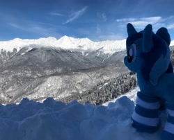 Size: 3736x3021 | Tagged: safe, artist:spacelight_unicorn, imported from derpibooru, oc, oc only, oc:spacelight, pony, unicorn, clothes, female, horn, irl, mare, mountain, photo, plushie, russia, scenery, snow, socks, solo, striped socks, unicorn oc, winter