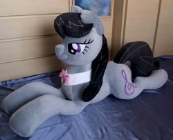 Size: 3152x2554 | Tagged: safe, artist:adamar44, imported from derpibooru, octavia melody, earth pony, pony, bed, bowtie, female, irl, lidded eyes, mare, photo, plushie, smiling