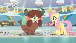 Size: 1366x768 | Tagged: safe, imported from derpibooru, screencap, fluttershy, yona, pegasus, pony, yak, she's all yak, bow, cloven hooves, crossed hooves, dotted line, duo, female, gym, hair bow, hoofprints, mare, monkey swings, paper, twisting