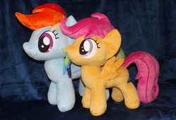 Size: 1280x875 | Tagged: safe, artist:peruserofpieces, imported from derpibooru, rainbow dash, scootaloo, pegasus, pony, blank flank, comparison, duo, female, filly, happy, irl, mare, photo, plushie, profile, rainbow dash plushie, scootaloo plushie, side by side, smiling, spread wings, toy, wings