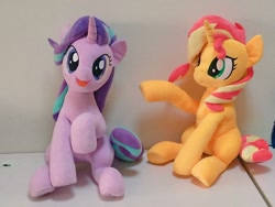 Size: 1024x768 | Tagged: safe, artist:nekokevin, imported from derpibooru, starlight glimmer, sunset shimmer, pony, unicorn, series:nekokevin's glimmy, duo, female, irl, looking at you, mare, open mouth, photo, plushie, raised hoof, sitting, smiling, underhoof
