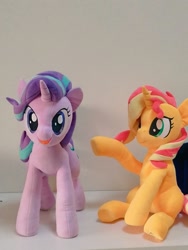 Size: 768x1024 | Tagged: safe, artist:nekokevin, imported from derpibooru, starlight glimmer, sunset shimmer, pony, unicorn, series:nekokevin's glimmy, duo, female, irl, looking at you, mare, open mouth, photo, plushie, raised hoof, sitting, smiling, underhoof