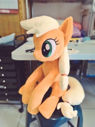 Size: 768x1024 | Tagged: safe, artist:nekokevin, imported from derpibooru, applejack, earth pony, pony, female, freckles, irl, mare, photo, plushie, sitting, smiling, solo, table