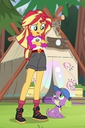 Size: 683x1022 | Tagged: safe, imported from derpibooru, screencap, spike, spike the regular dog, sunset shimmer, dog, equestria girls, legend of everfree, boots, camp everfree logo, camp everfree outfits, cap, clothes, collar, crossed arms, frown, hat, legs, male, paws, raised eyebrow, shoes, shorts, socks, spike's dog collar, tail, tent