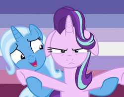 Size: 1010x791 | Tagged: dead source, safe, artist:lynmunn, imported from derpibooru, starlight glimmer, trixie, pony, female, floppy ears, lesbian, lesbian pride flag, shipping, startrix, trixie's puppeteering