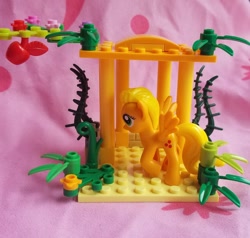 Size: 1280x1218 | Tagged: safe, artist:heckyeahponyscans, imported from derpibooru, applejack, pegasus, pony, apple, bootleg, bootleg lego, flapplejack, food, irl, my little lony, not applejack, not fluttershy, photo, race swap, solo, toy