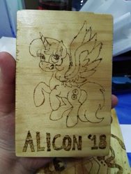 Size: 439x585 | Tagged: safe, artist:dawn-designs-art, artist:sapphire-burns-art, imported from derpibooru, oc, oc:spheres, alicorn, pony, convention mascots, convention:alicon, mascot, photo, pyrography, solo, traditional art
